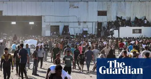 Four people killed after starving Palestinians burst into UN food warehouse in Gaza